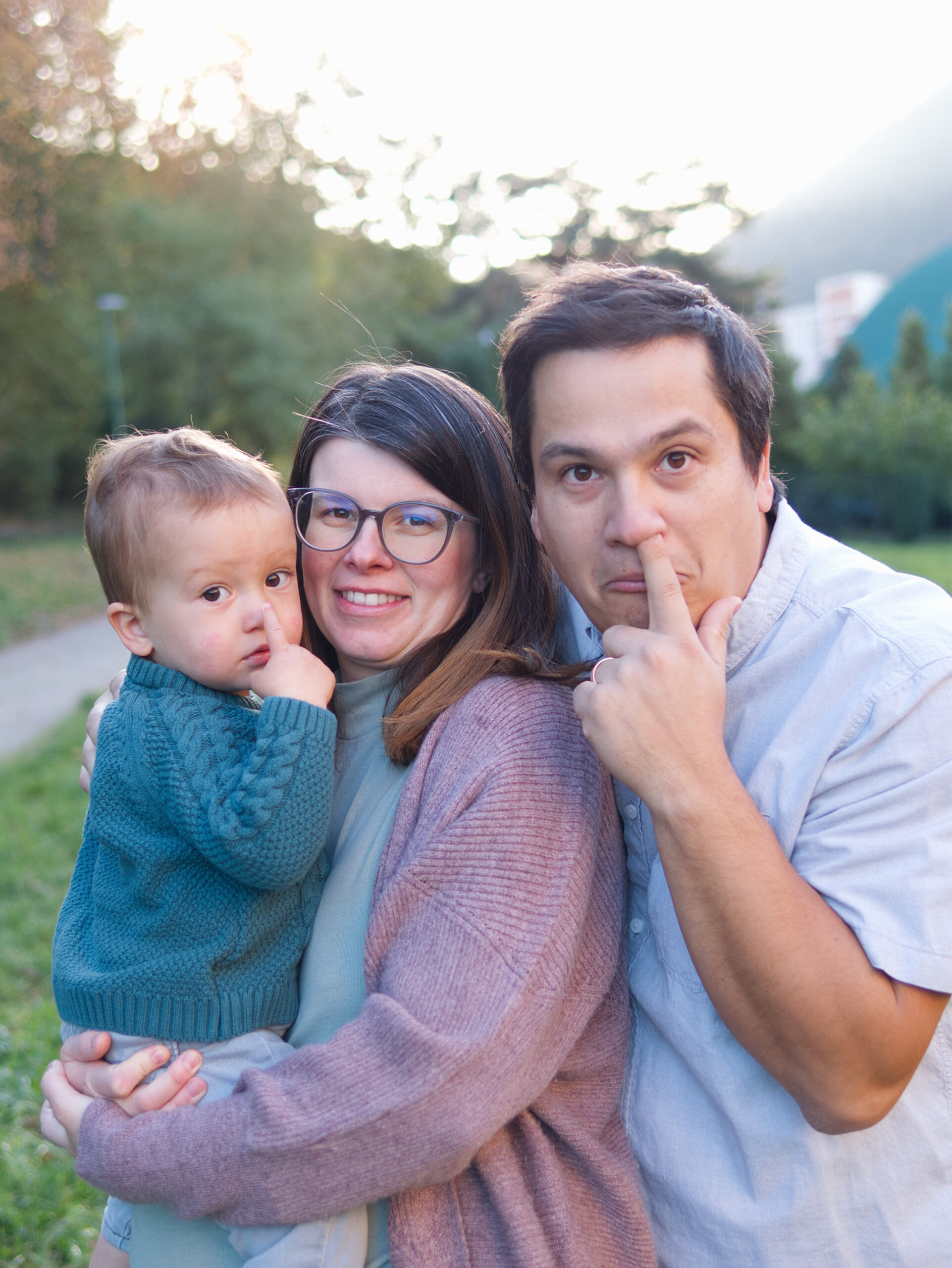 Family portrait session with mum, dad and toddler, taken by a Medway photographer at dusk in autumn