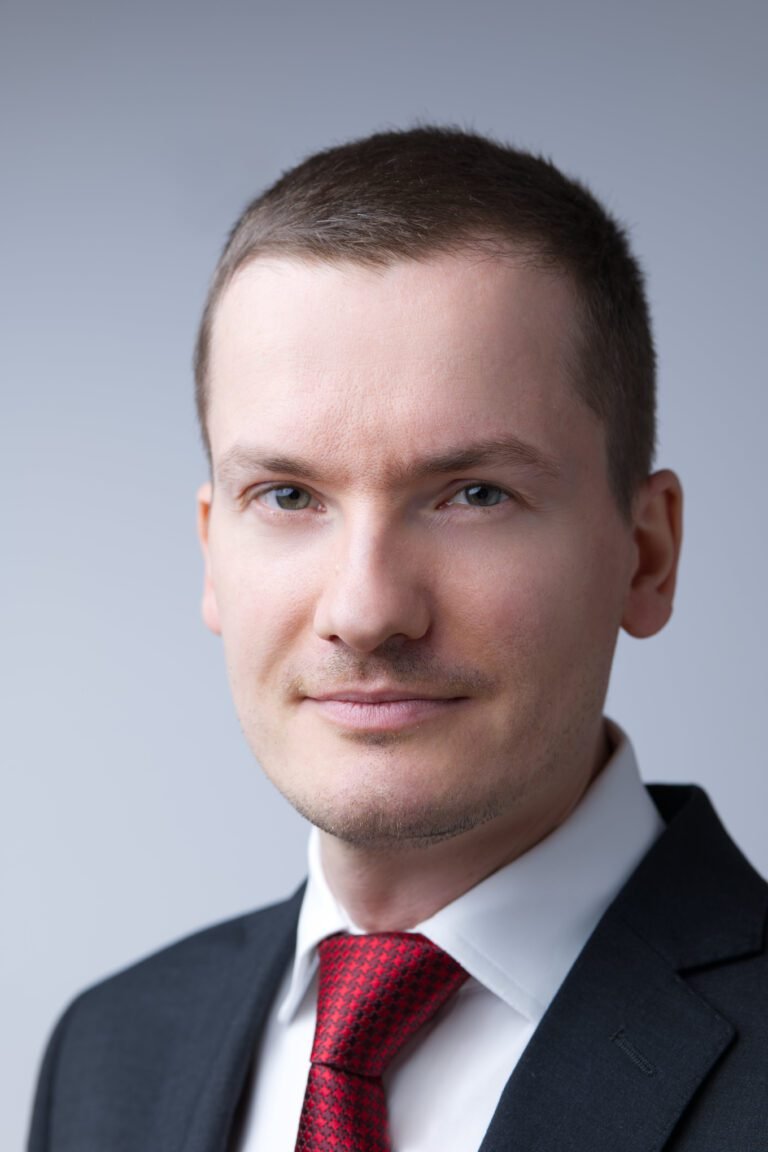 Male headshot shot against a light background shot by a Kent headshot photographer