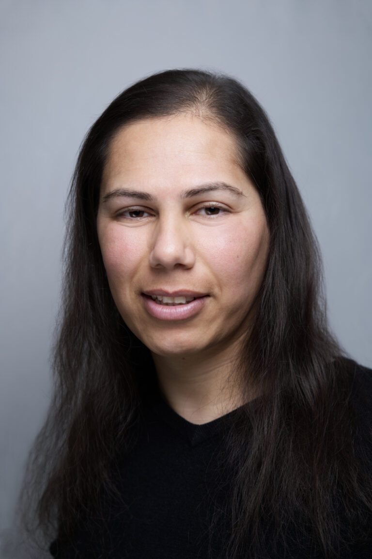 Headshot close up of a woman dressed in a black top, taken by a business photographer in Kent
