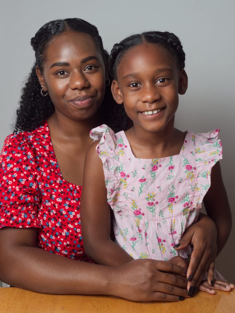 Family photographer Kent Mother and daughter smiling and looking at the camera of a Kent portrait photographer