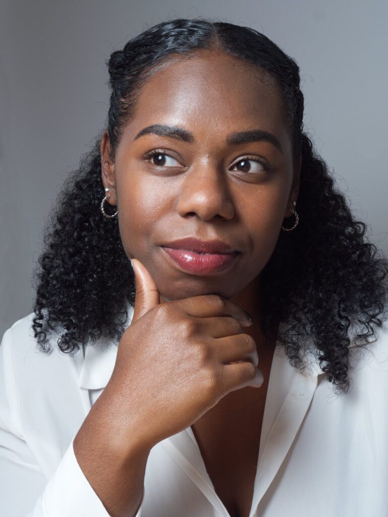 Clothes anxiety? What to Wear for Headshots (with Checklist) A woman wearing business attire as an example to what to wear for a headshot session