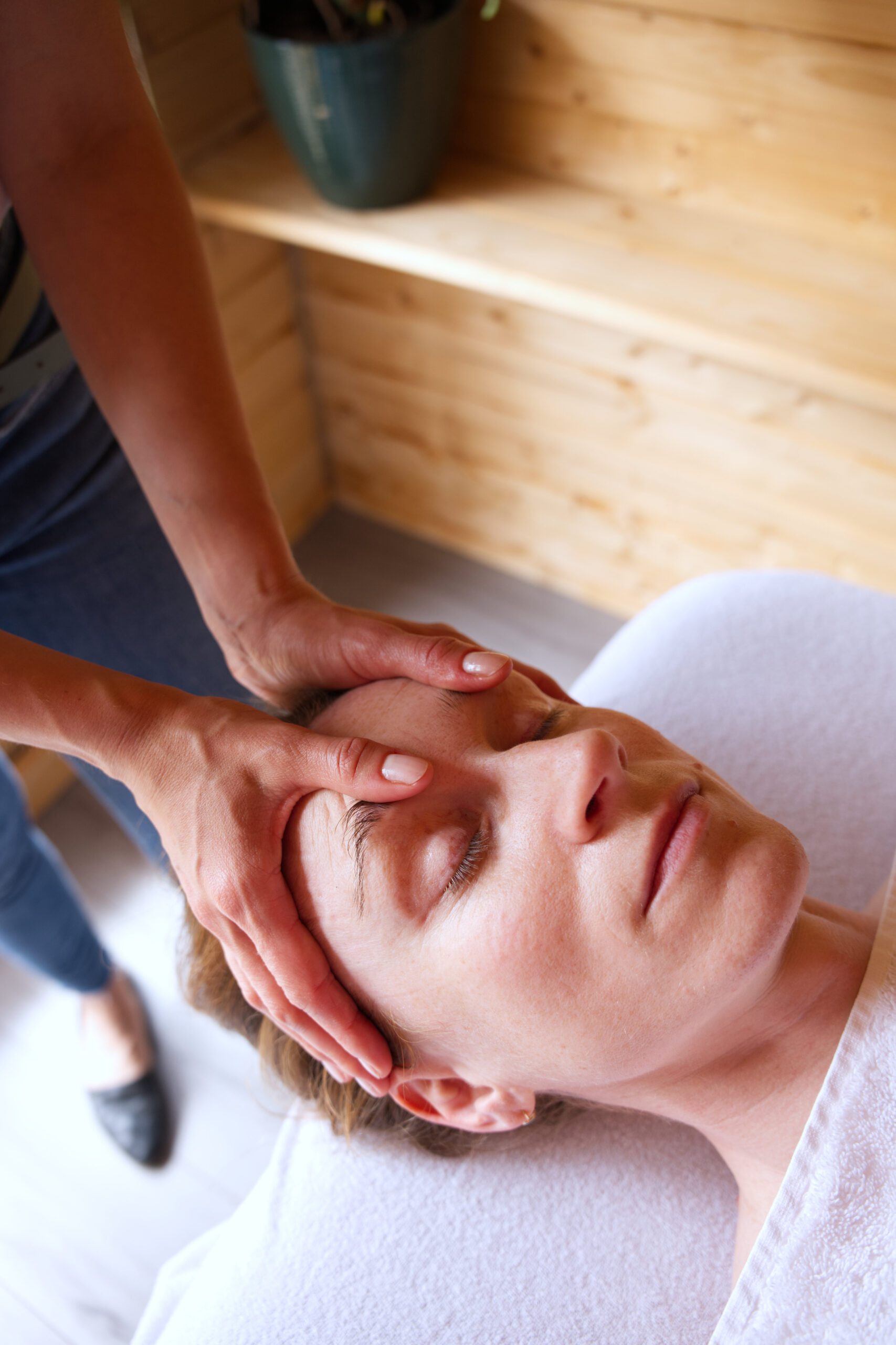 A woman receiving a head massage during a Kent personal branding session in Rochester, Medway