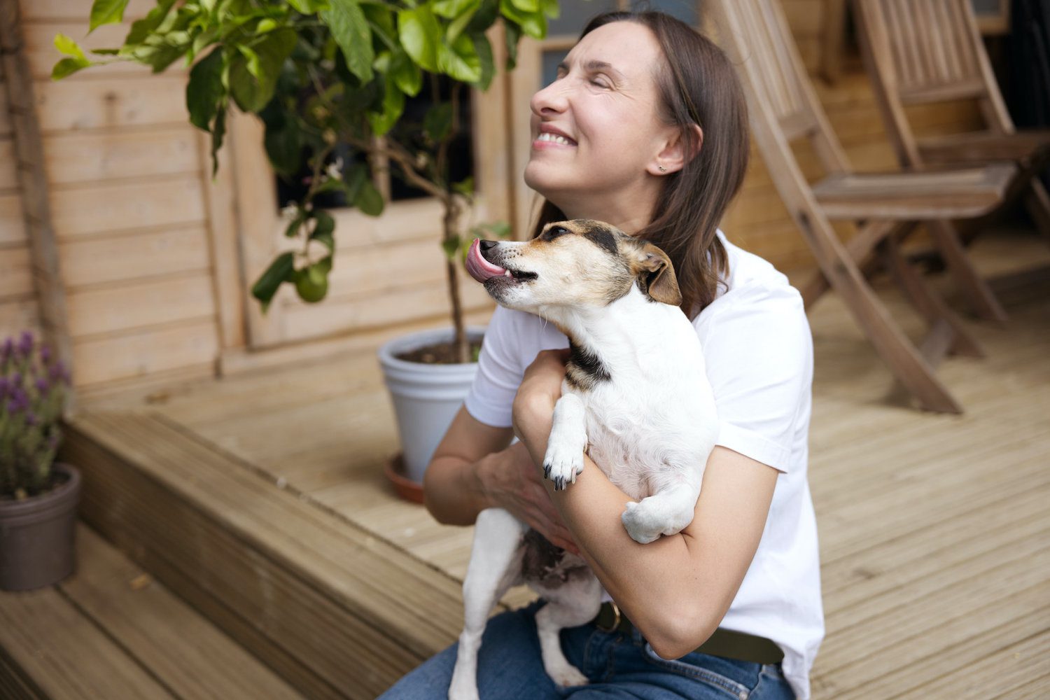 Wellness and massage therapist in Strood, in a candid personal branding shoot with her dog